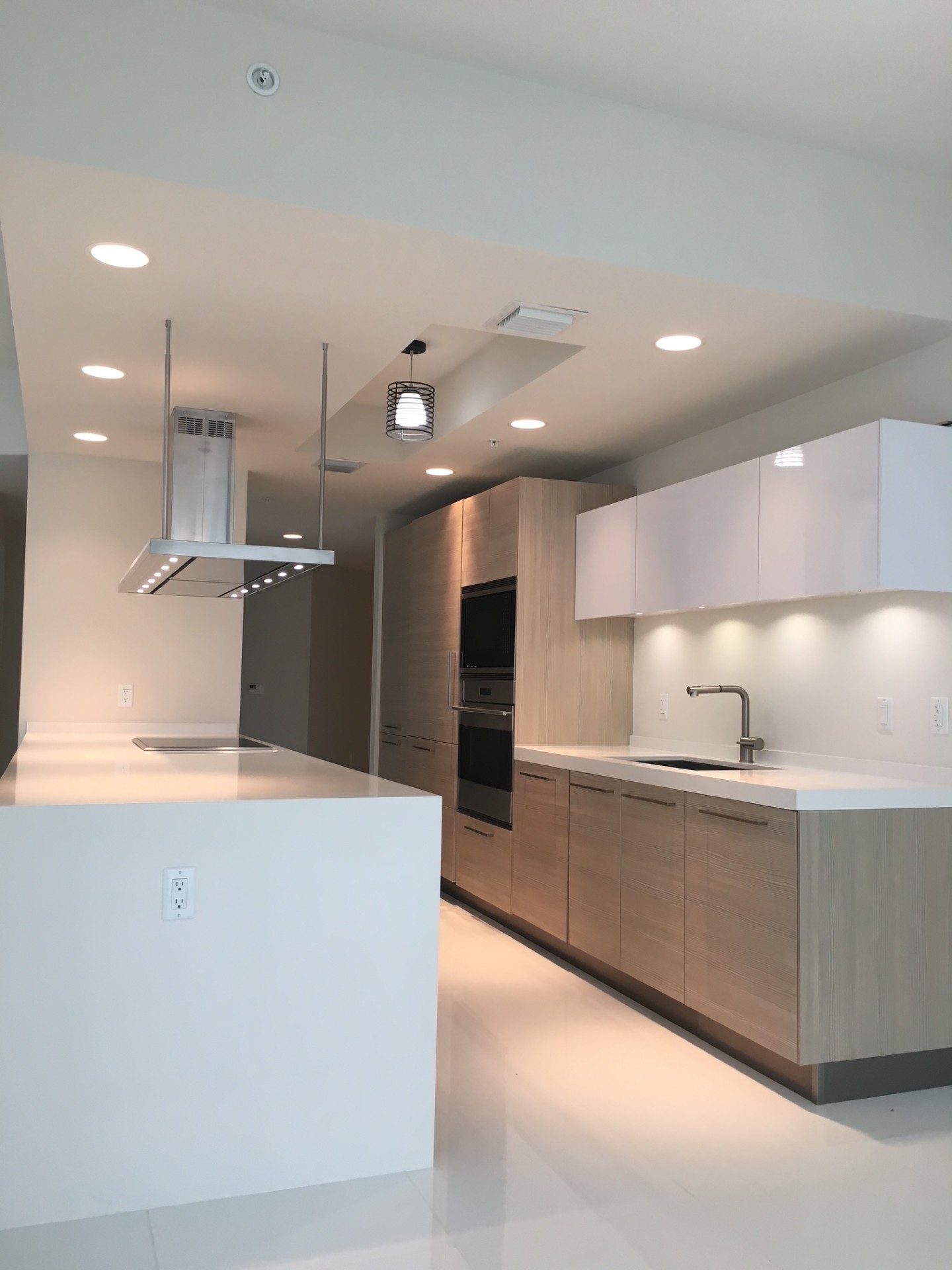 Modern kitchen with range hood and clean design