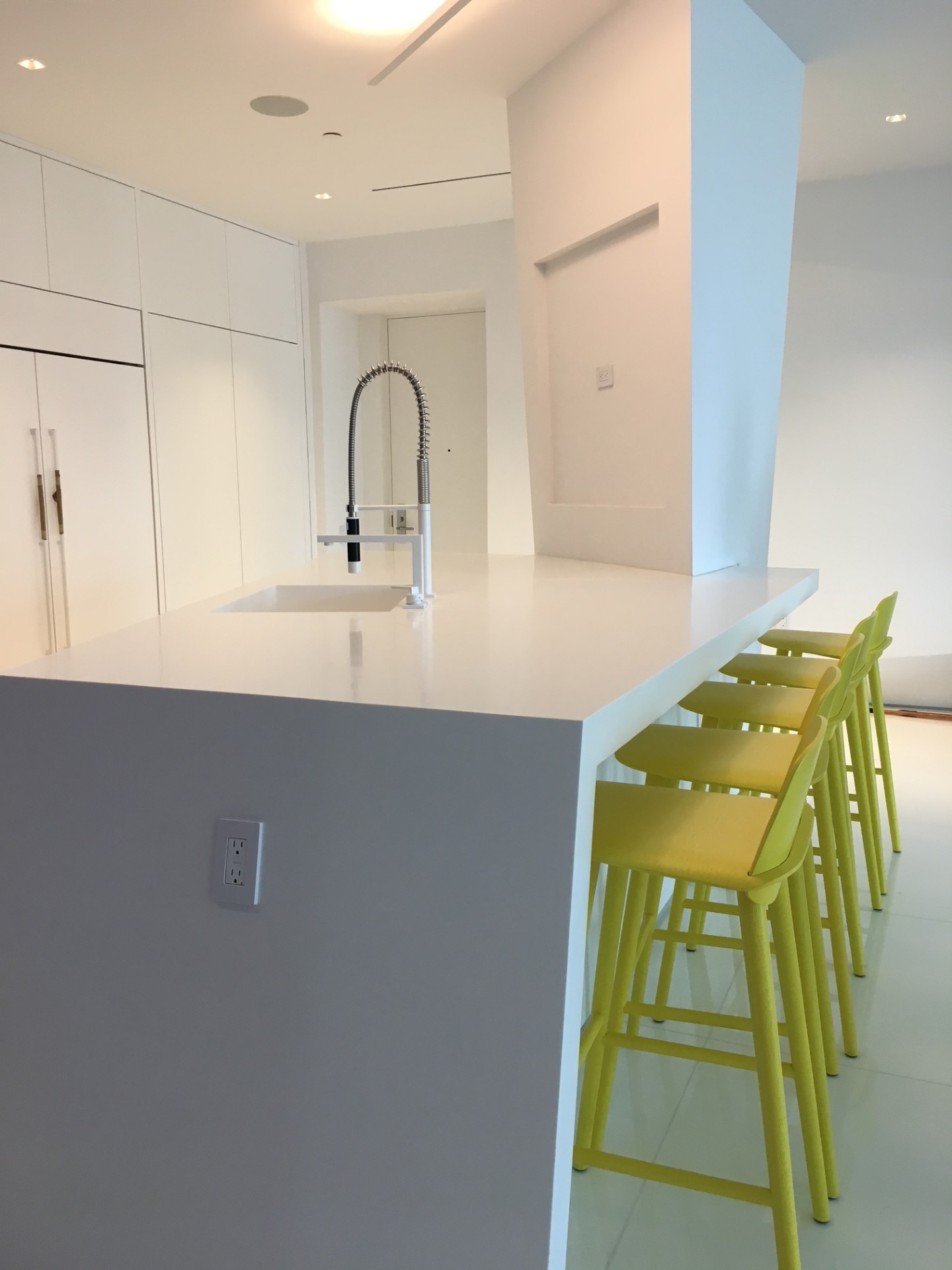 Kitchen island with green bar stools