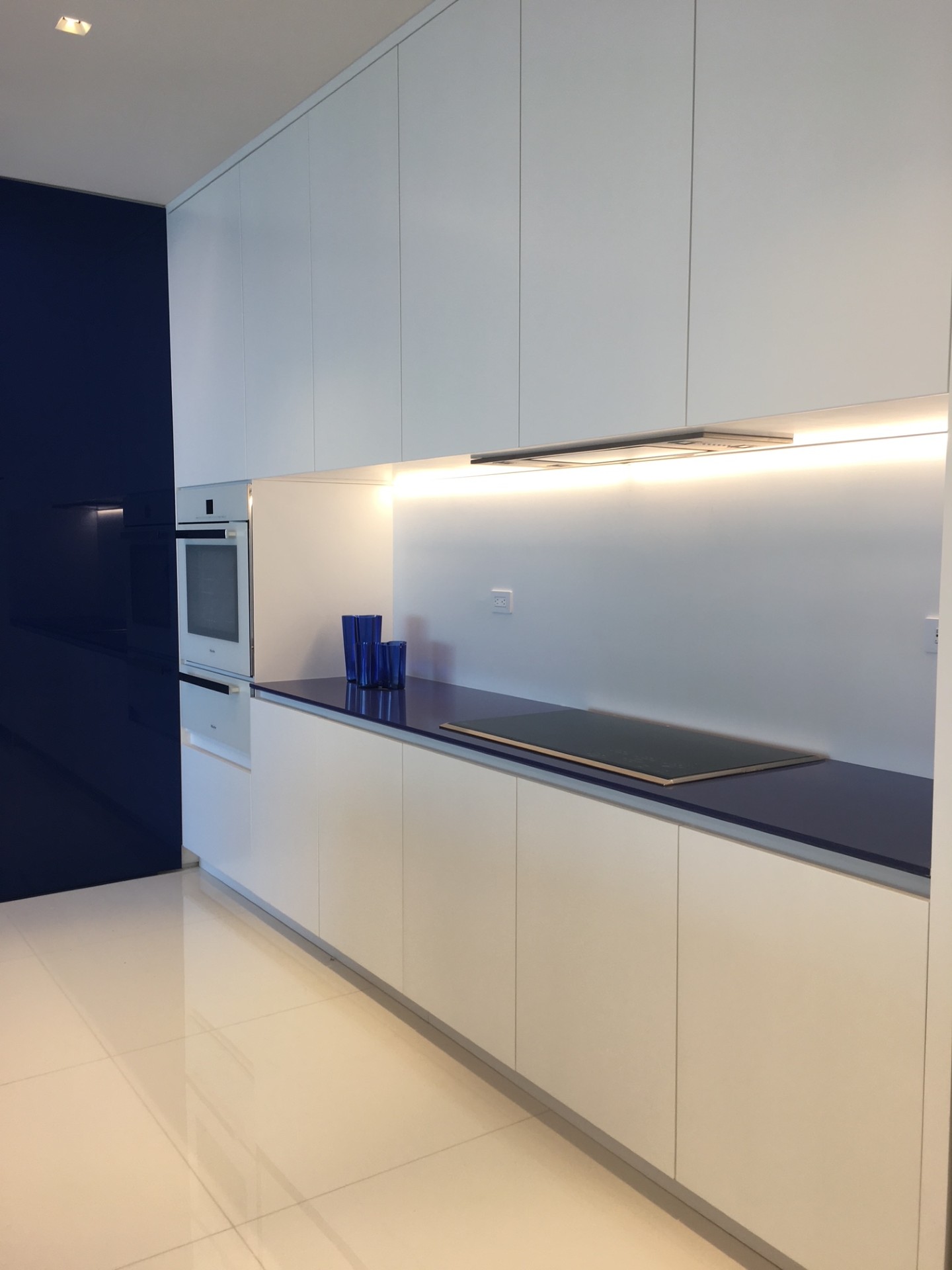 Kitchen with stove and cabinetry
